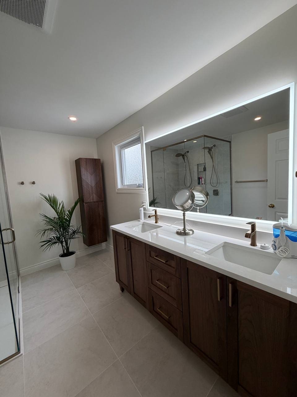 Bathroom with a walnut double vanity